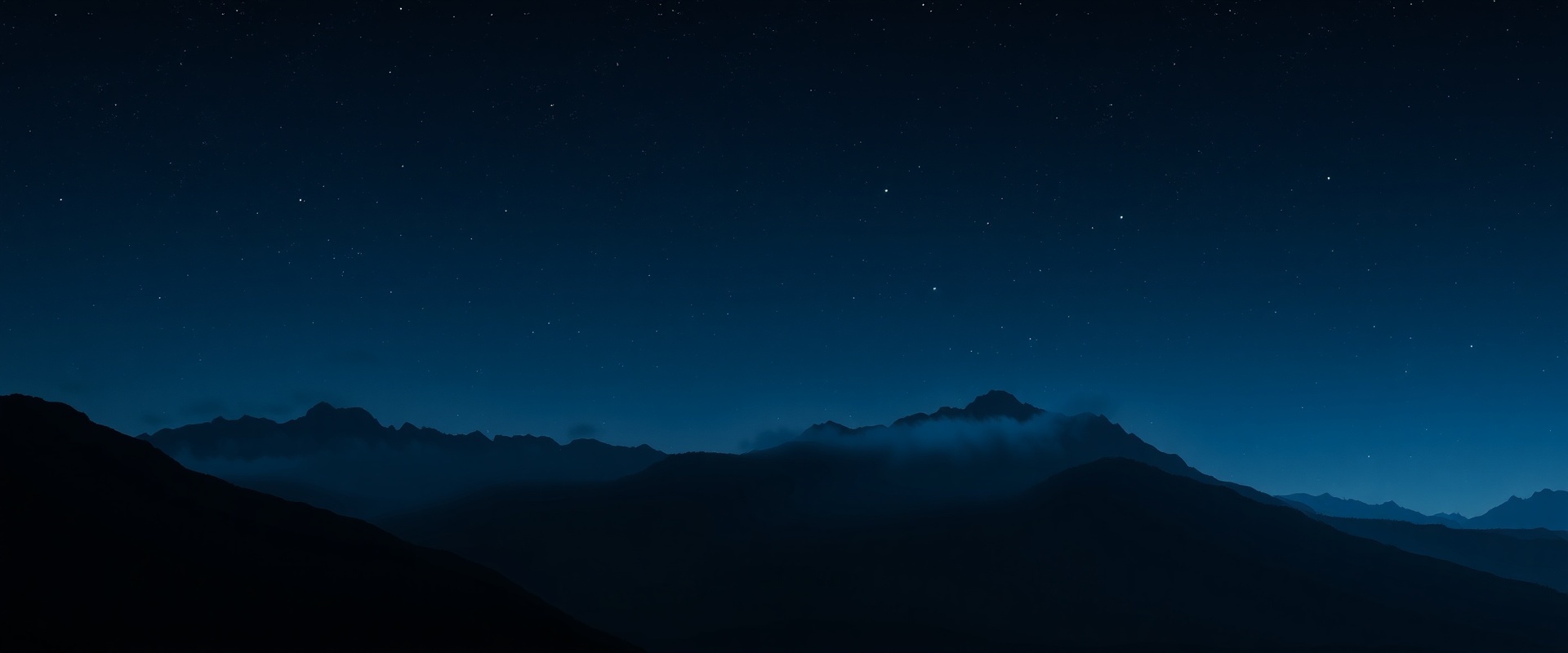 Dark mountain landscape at night representing off-grid energy independence